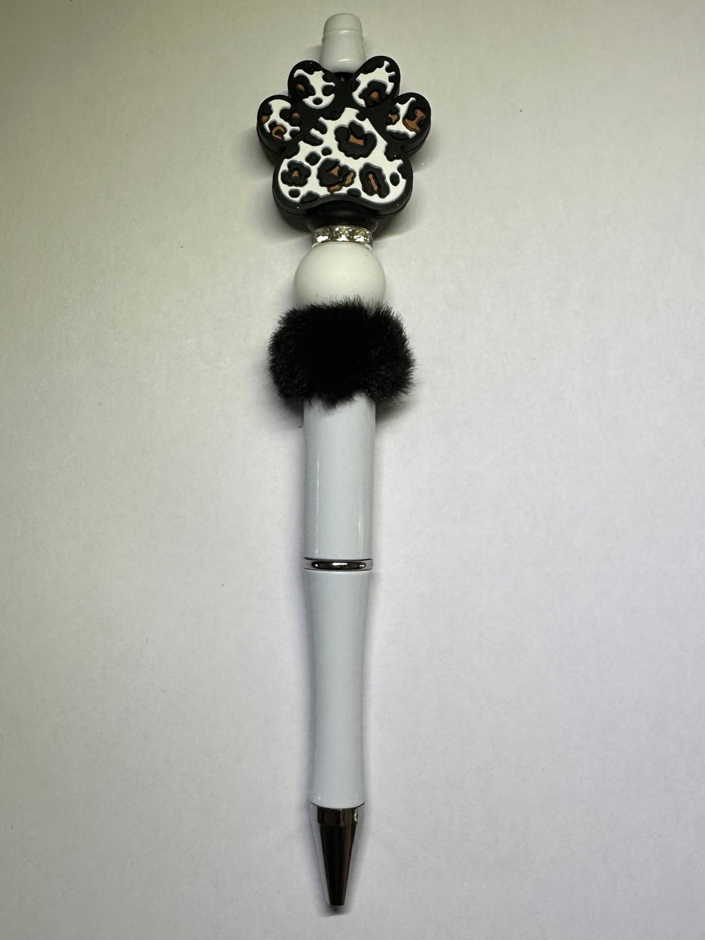 White paw print pen