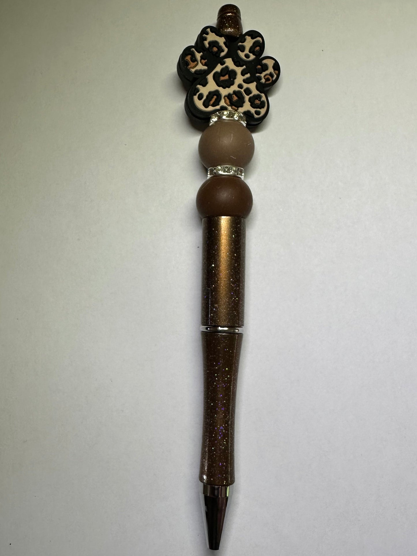 Brown paw print pen