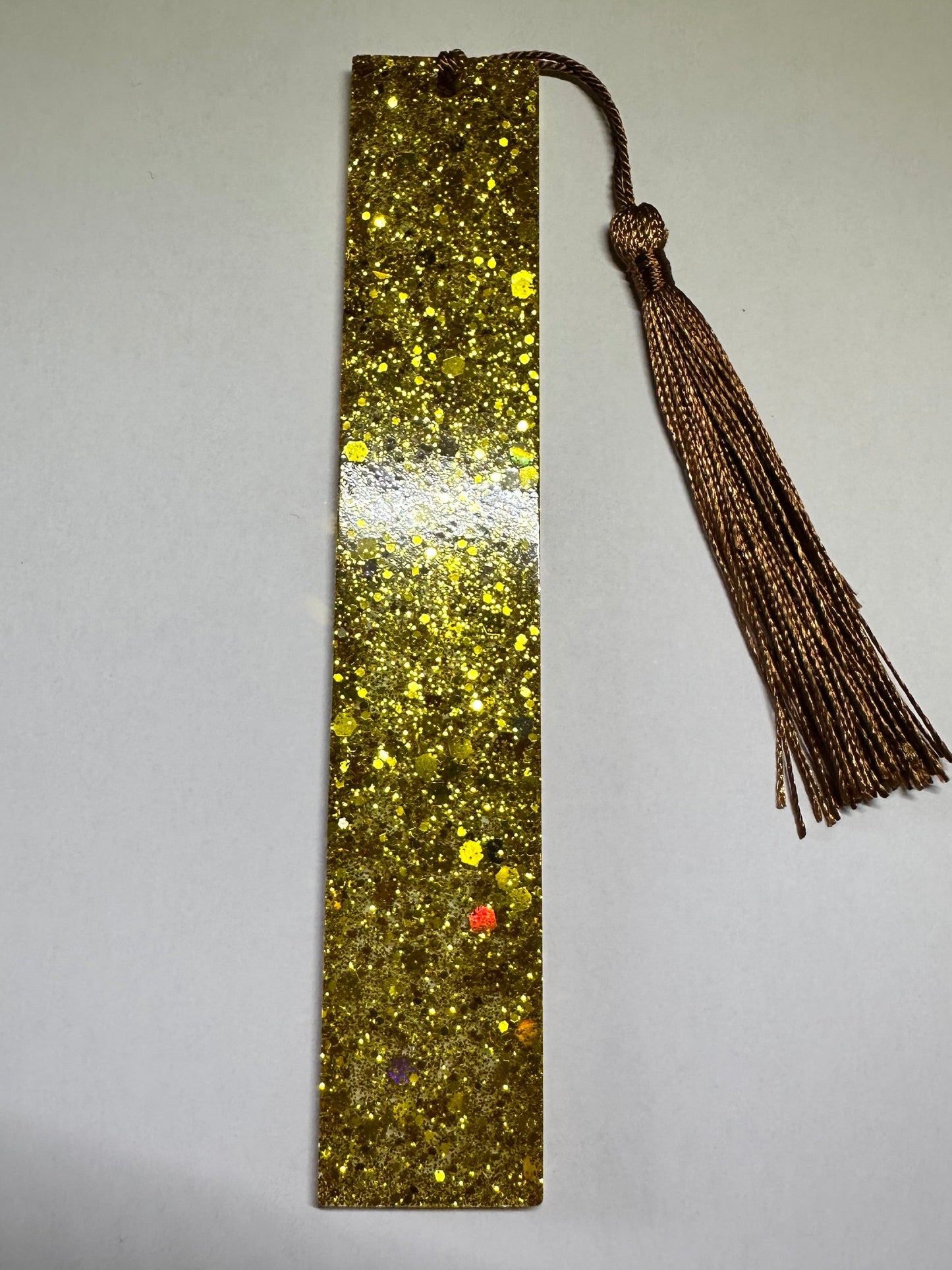 The millionaire gold glitter bookmark