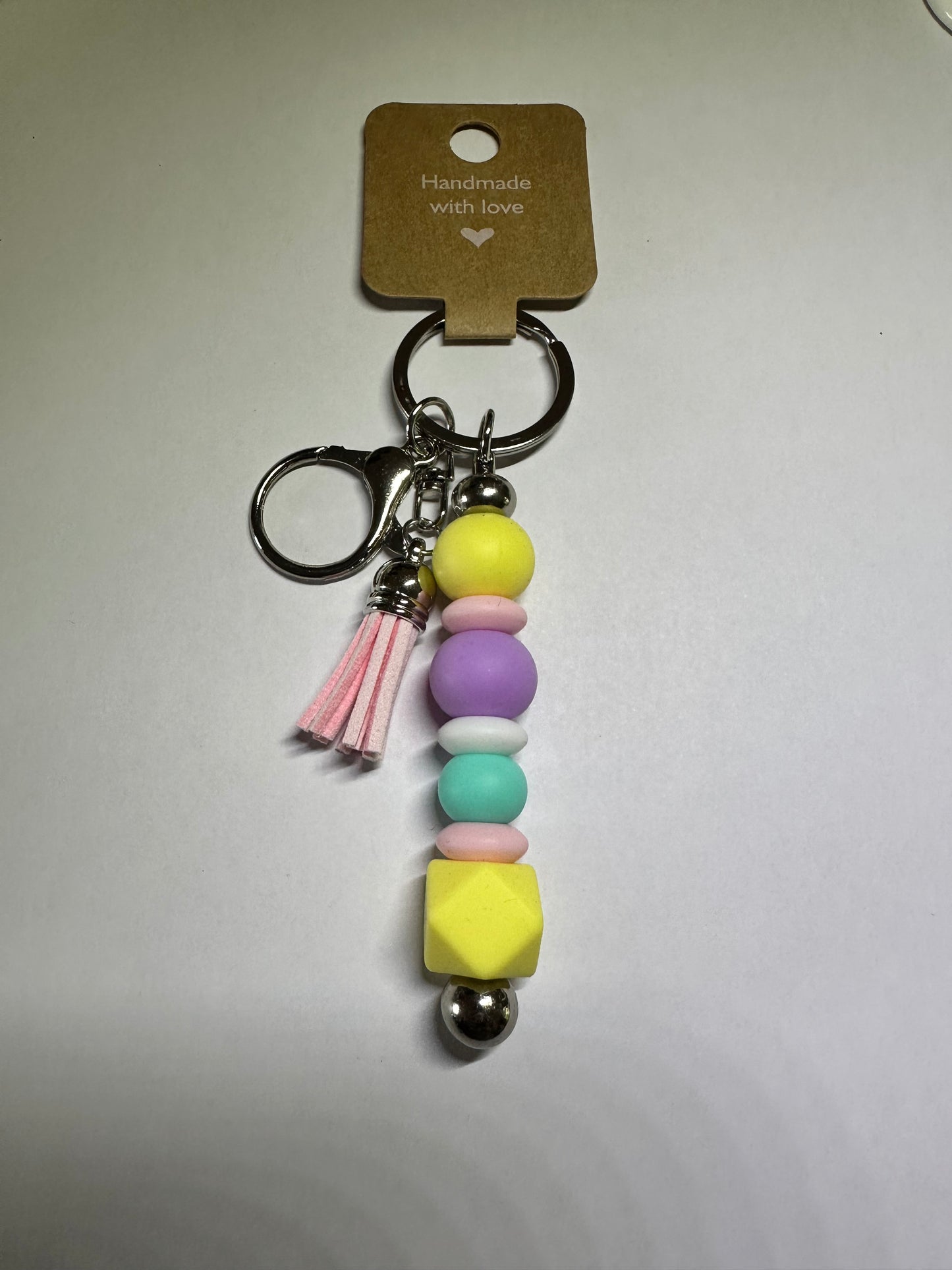 Geometric pastel keyring with pink tassel