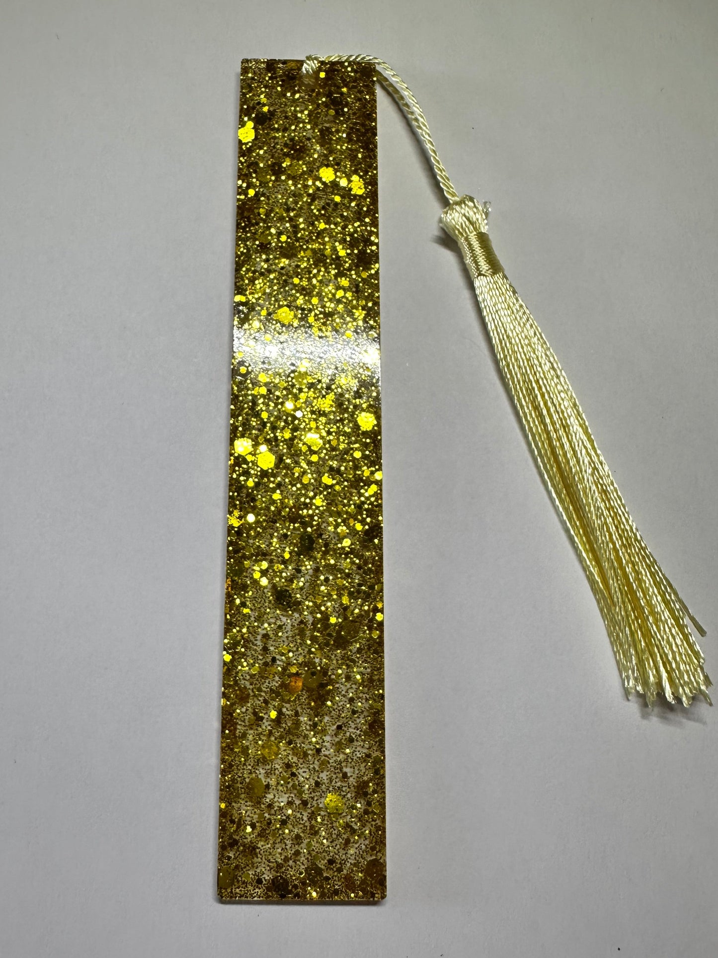 The billionaire gold glitter bookmark
