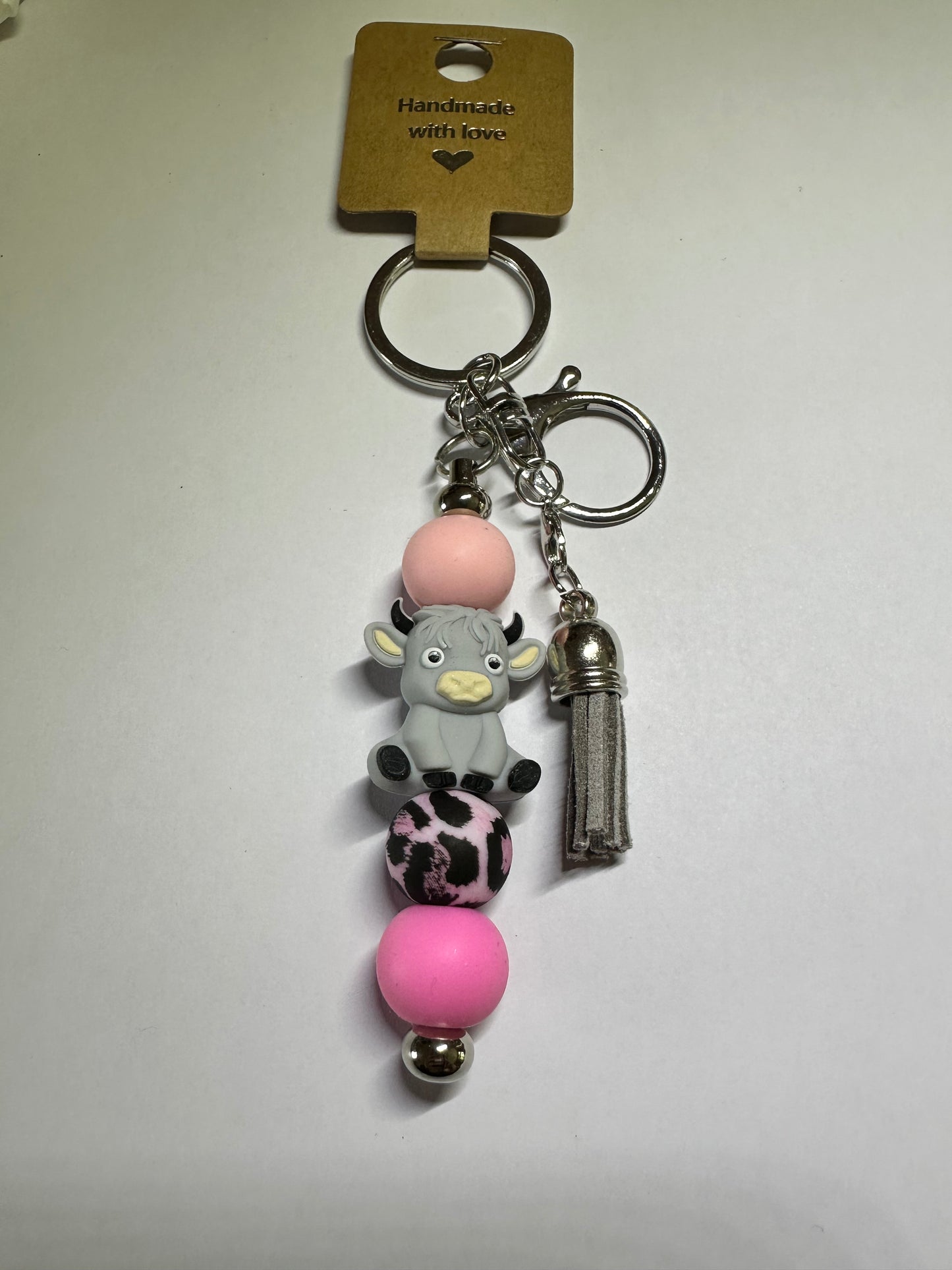 Grey and pink Highland cow keyring